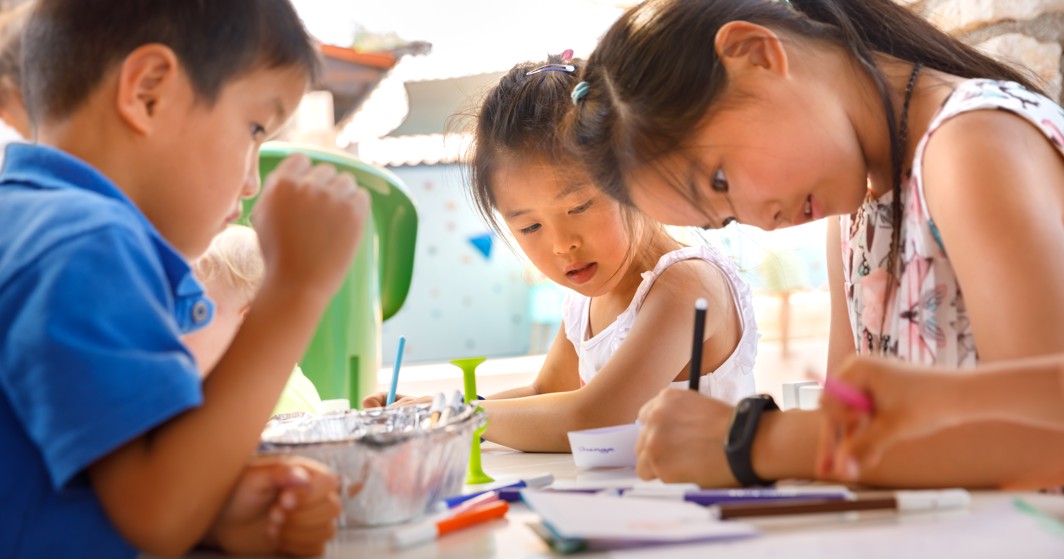 Children enjoying drawing and creative activities at the kids’ animation club at Aminess Vival Velaris Resort on Brač Island, Croatia.