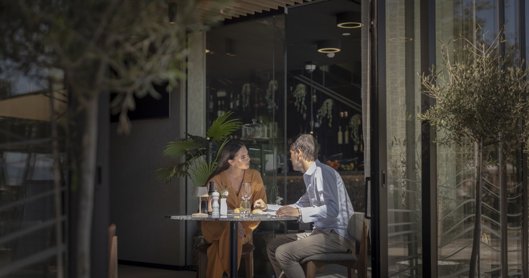 Guests enjoying a meal at Half8 restaurant at Aminess Younique Narrivi Hotel.