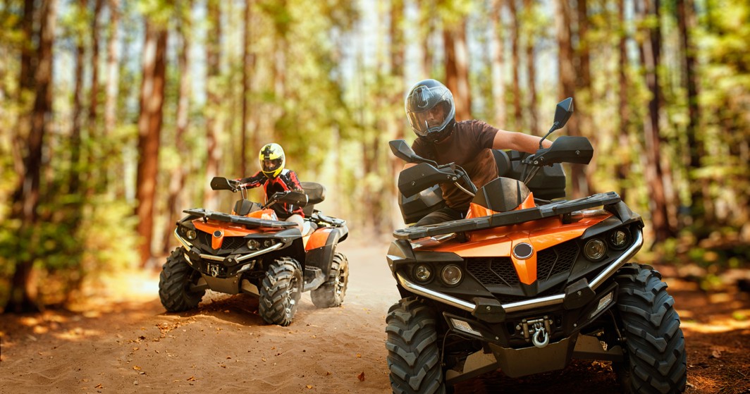 Guests enjoying an exciting ATV adventure through a forest near Veya Maradiso Hotel by Aminess.