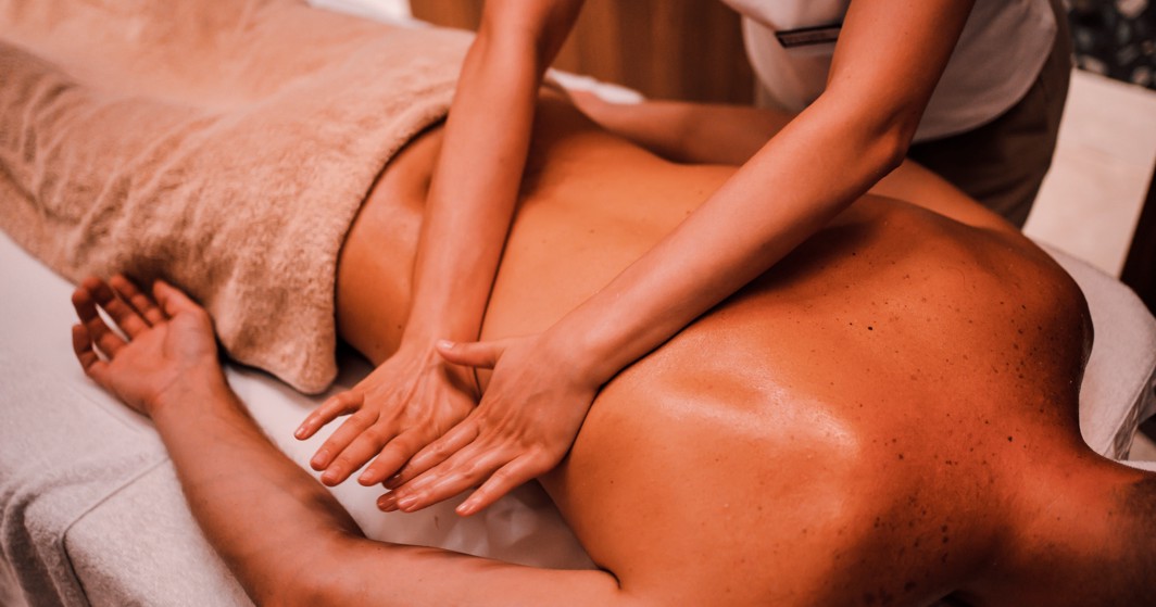 Relaxing back massage at Aminess Style Camping Avalona resort, offering wellness and tranquility.