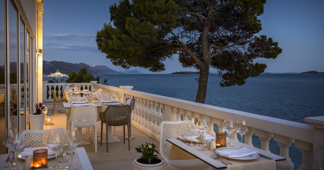 Hotel restaurant terrace overlooking the sea view with exterior seating terrace at Aminess Maradiso Bellevue Village.
