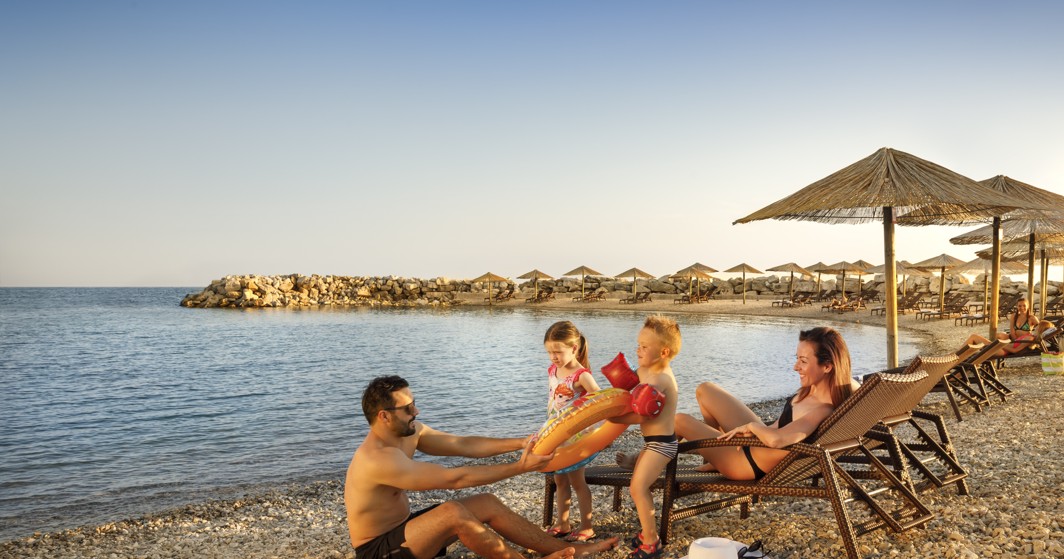 Family at the beach at Aminess Maradiso Hotel Laguna, Novigrad Croatia