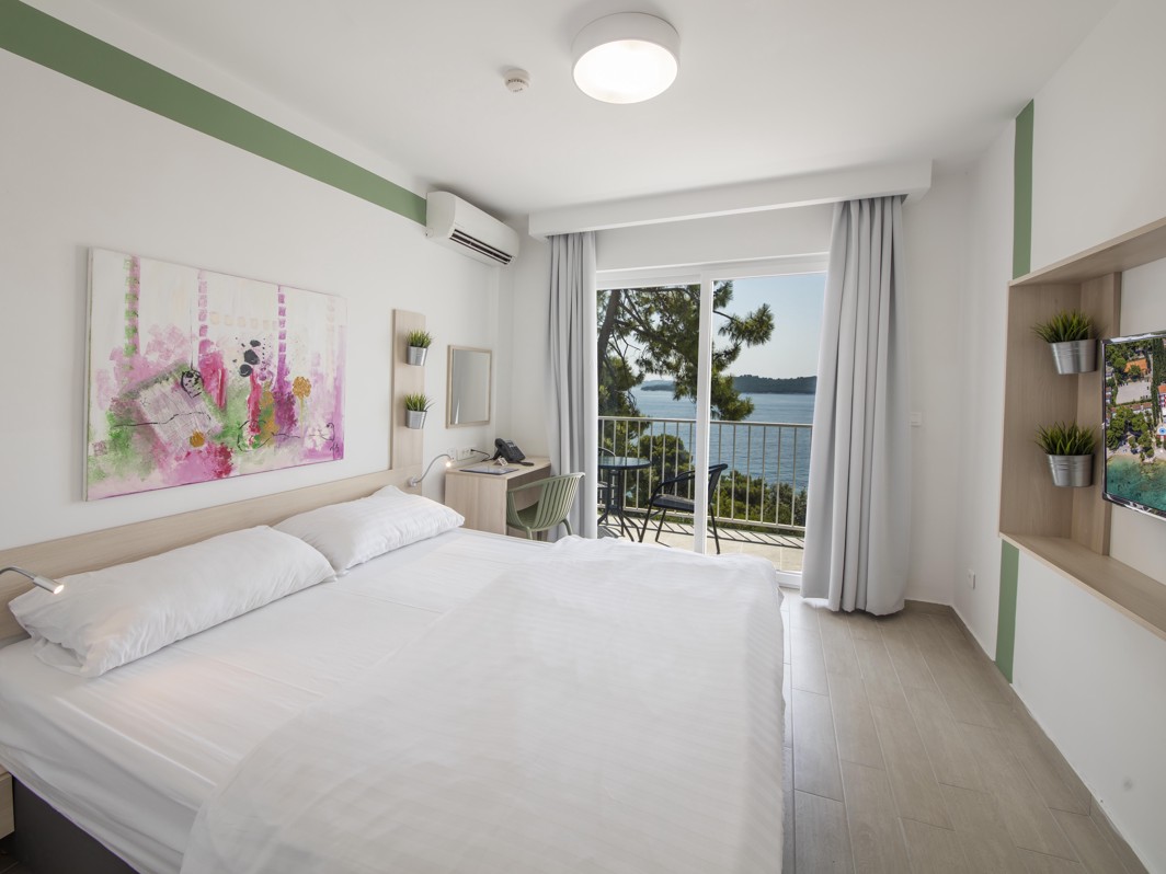 Comfort double room with seaside balcony featuring modern design and seaside view in Orebic at Aminess Maradiso Casa Bellevue.