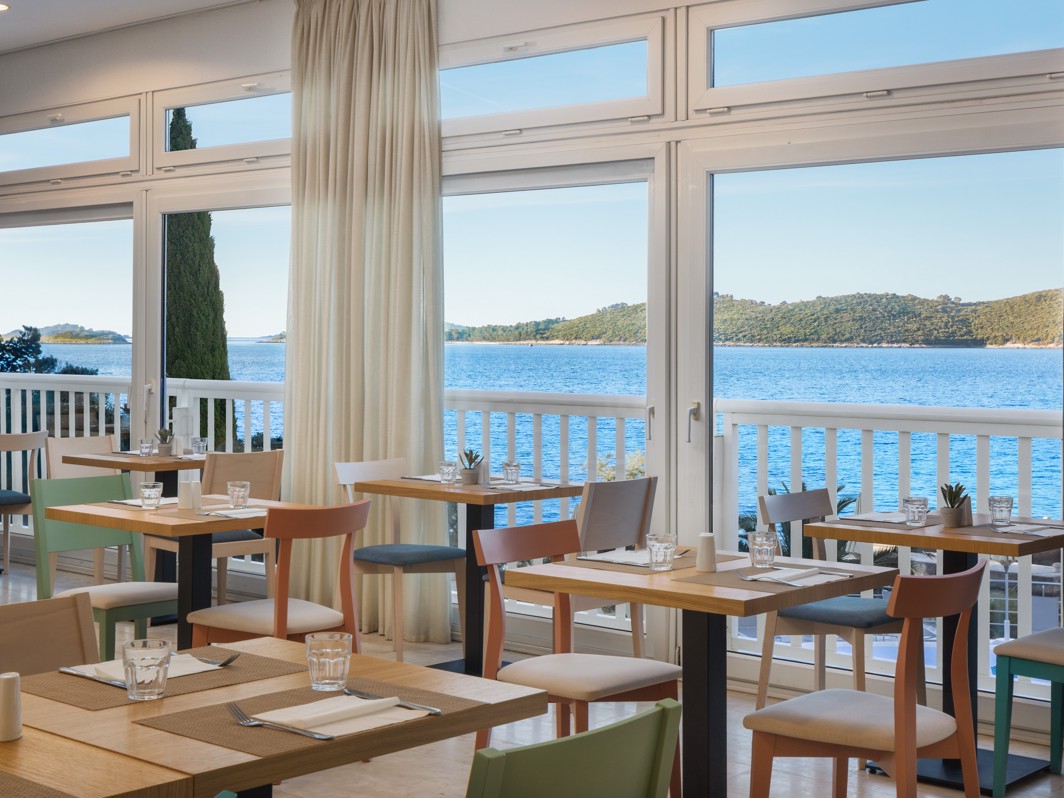 Restaurant at Orsan Maradiso Hotel by Aminess with a sea view.