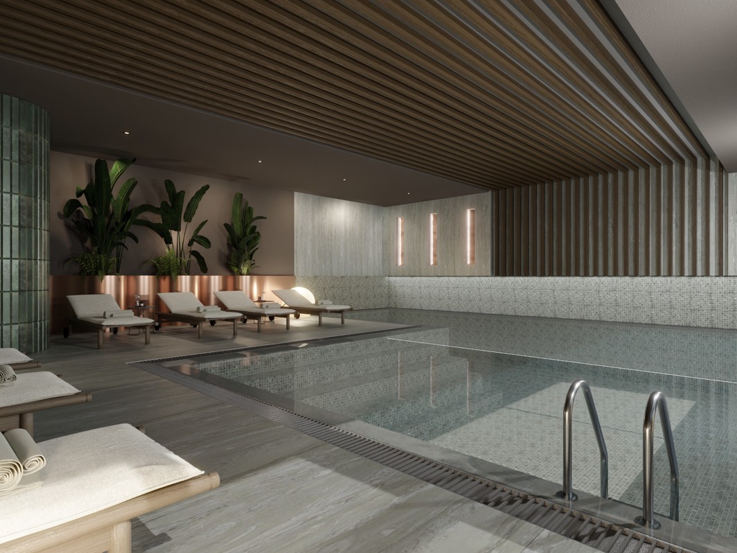 Innenpool im Hotel Wellnessbereich mit Liegen zum Entspannen