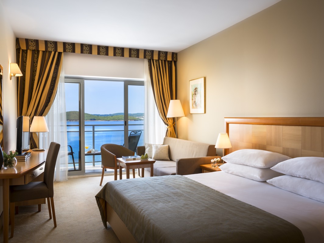 Cosy and modern room with a sea view balcony at Aminess Grand Azur Hotel.