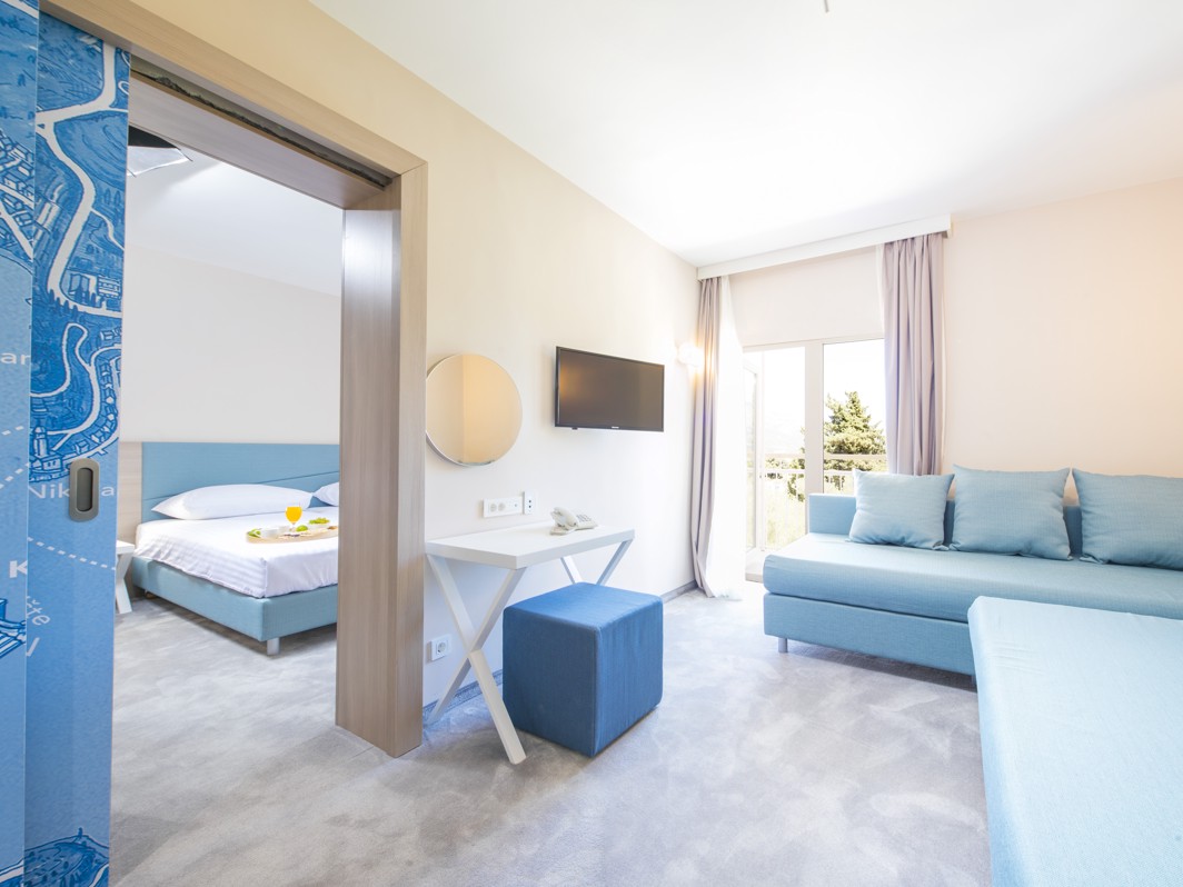 Modern room interior decor in a blue pallete at Aminess Vival Port9 Resort.