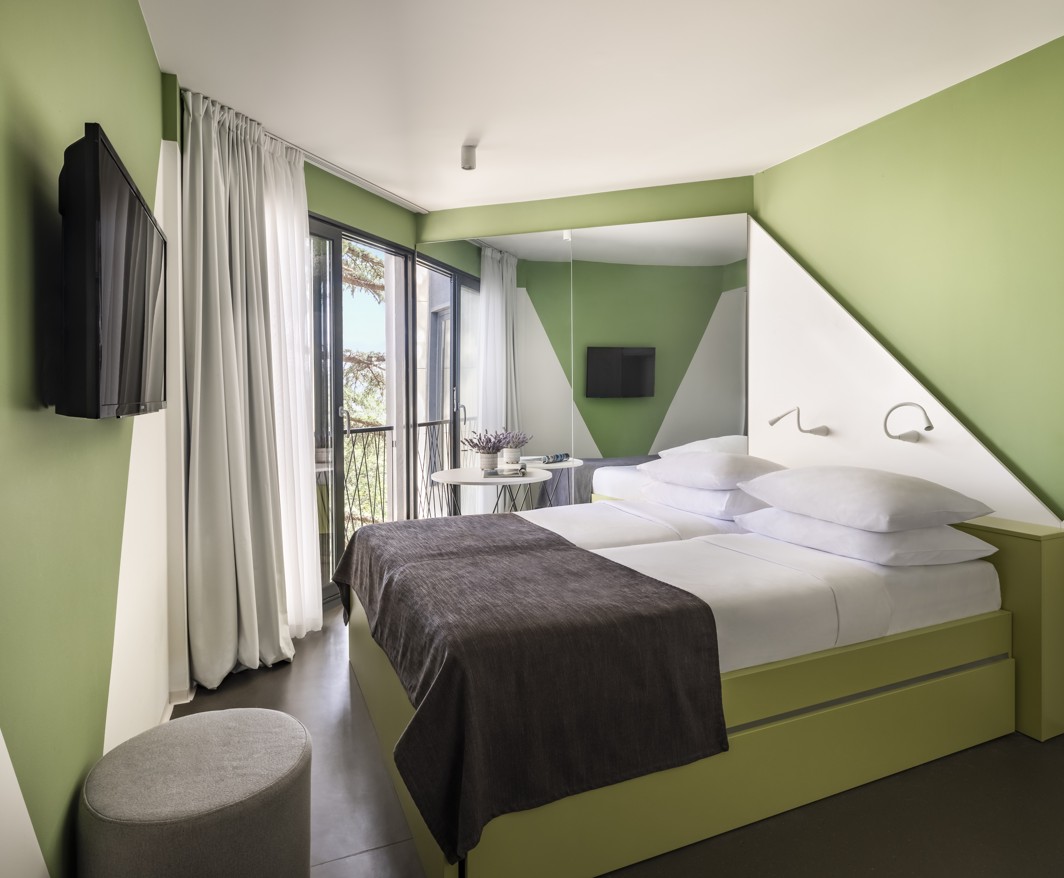 Modern and cozy bedroom at Aminess Vival Casa Lišanj with balcony access and a relaxing atmosphere in Novi Vinodolski.