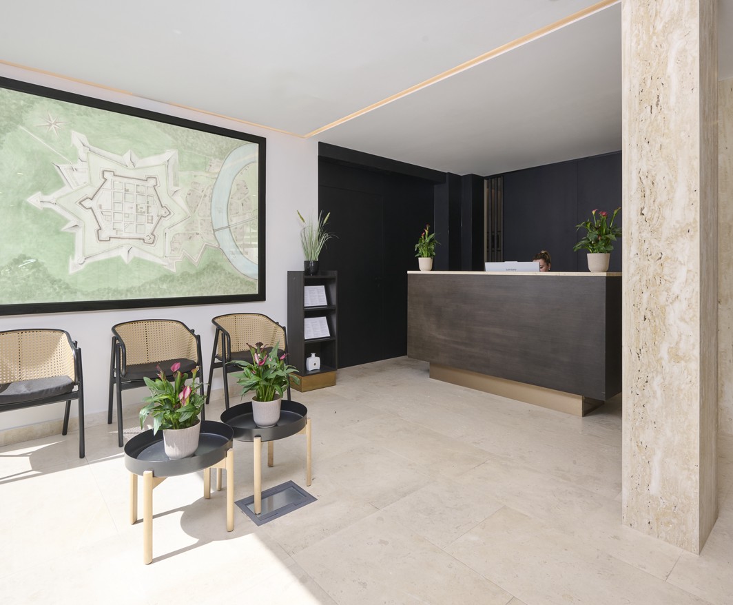 Reception desk and lobby of Aminess Florian Godler Hotel.