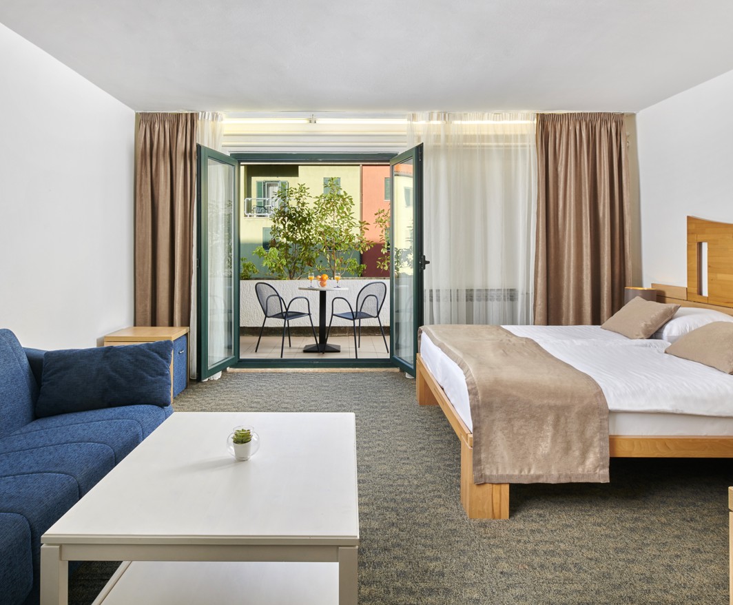 A spacious and comfortable room with a balcony at Veya Maradiso Hotel by Aminess.