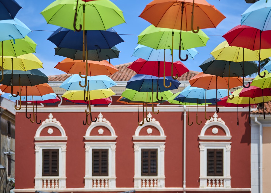 aminess-blog-colorful-umbrellas-old-town-street