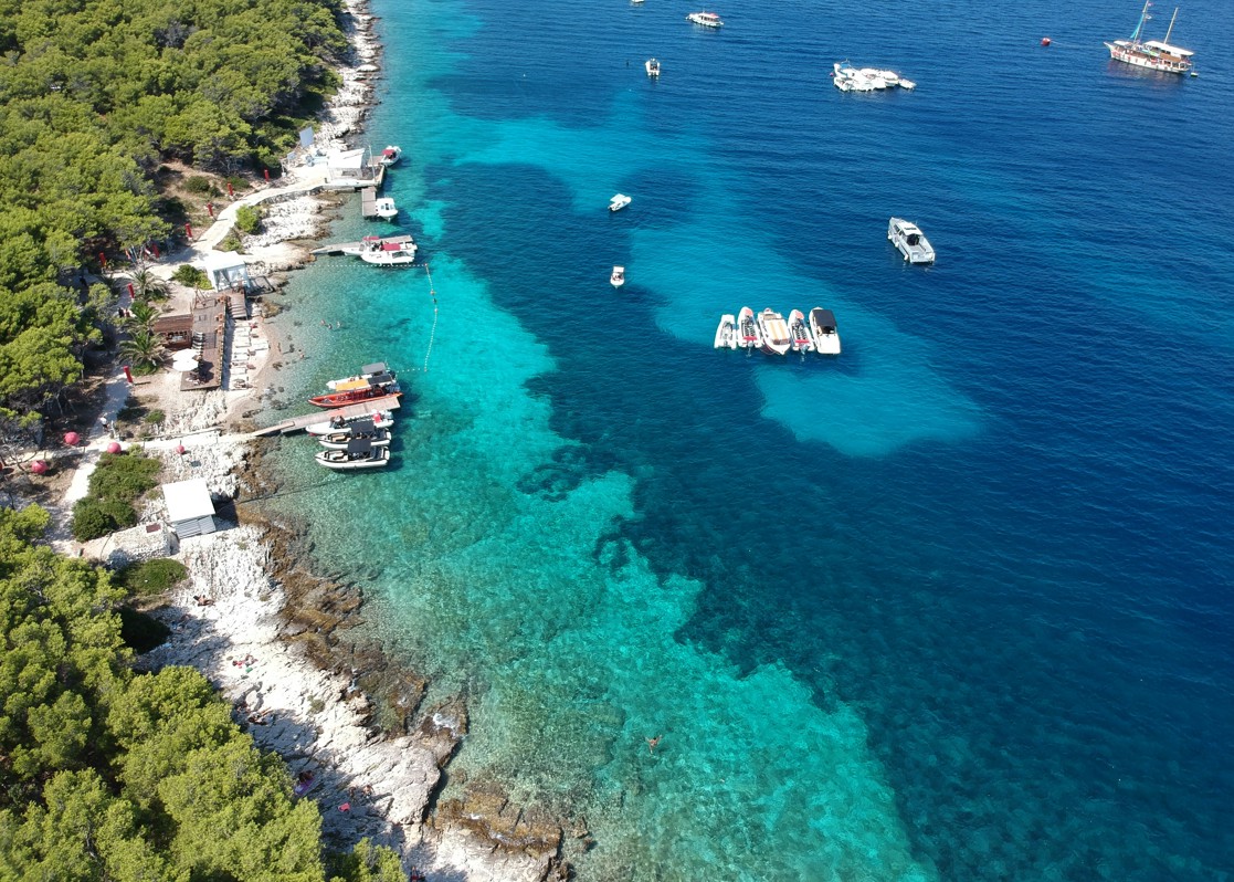 aminess-pine-coast-turquoise-sea-boats-aerial-view