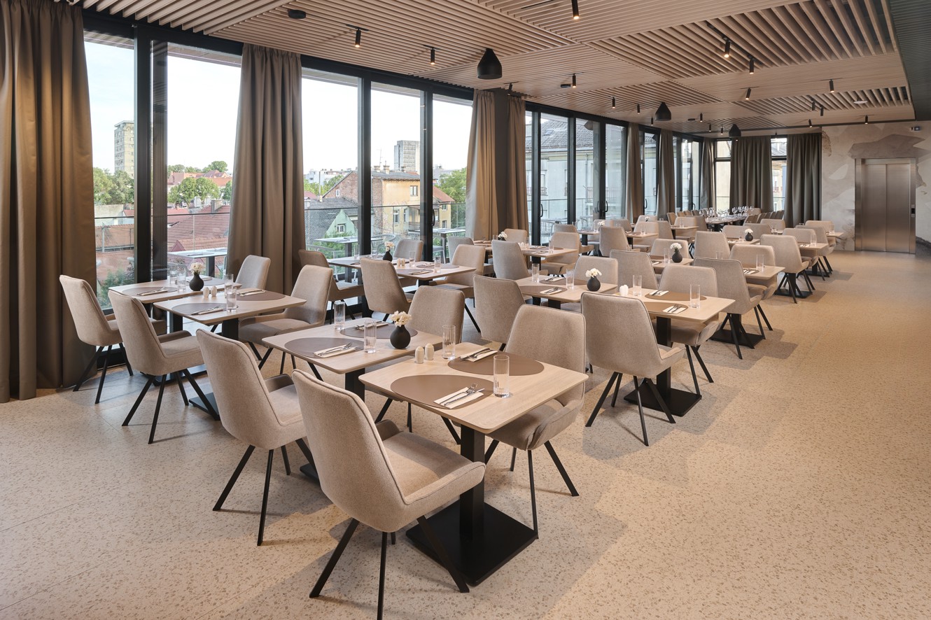 Spacious restaurant interior of Aminess Florian Godler Hotel.