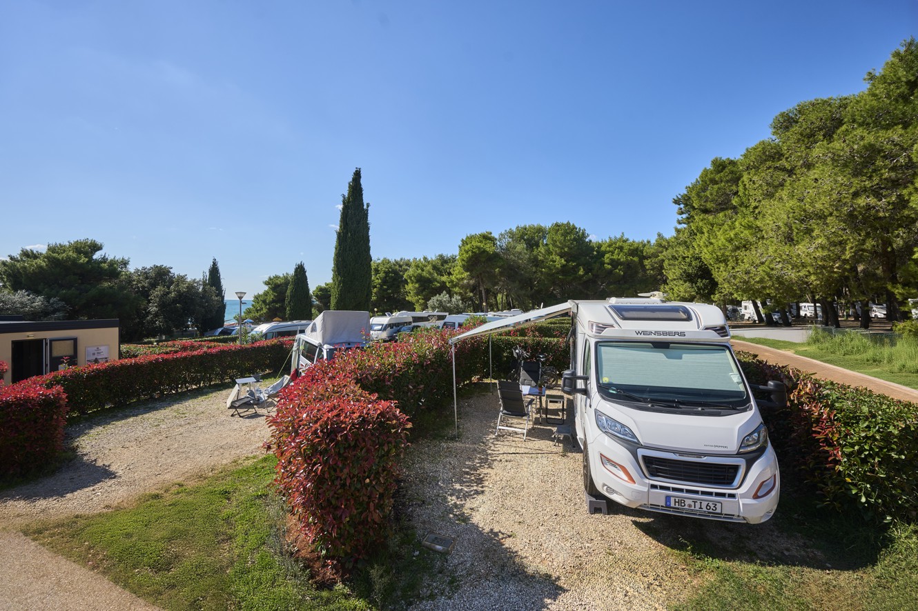 Panoramic view of Pitch Bella Vista at Aminess Style Camping Avalona Resort, surrounded by nature, a perfect spot for relaxation.