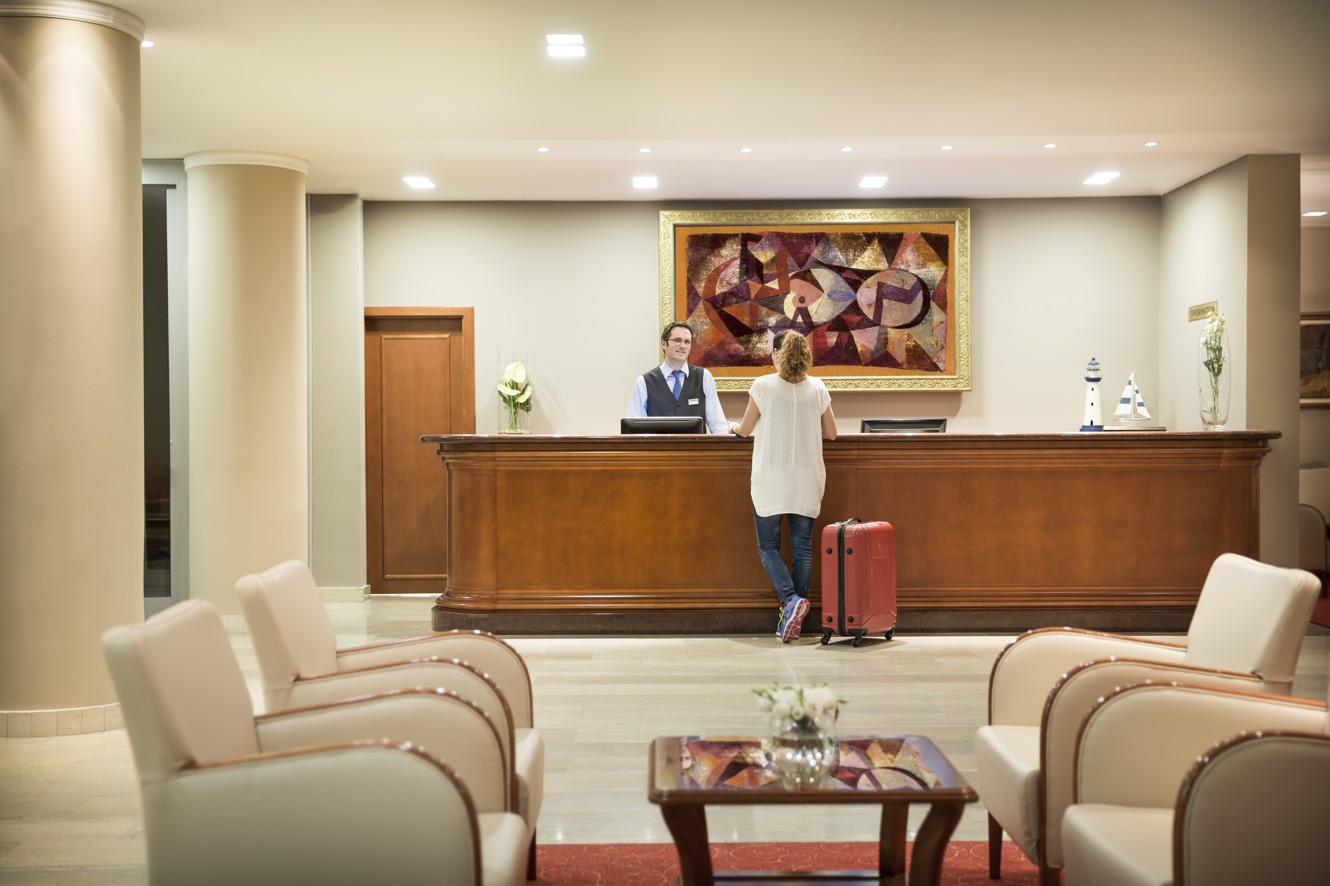 Guest welcomed by the helpfull receptionist at the Aminess Grand Azur Hotel.