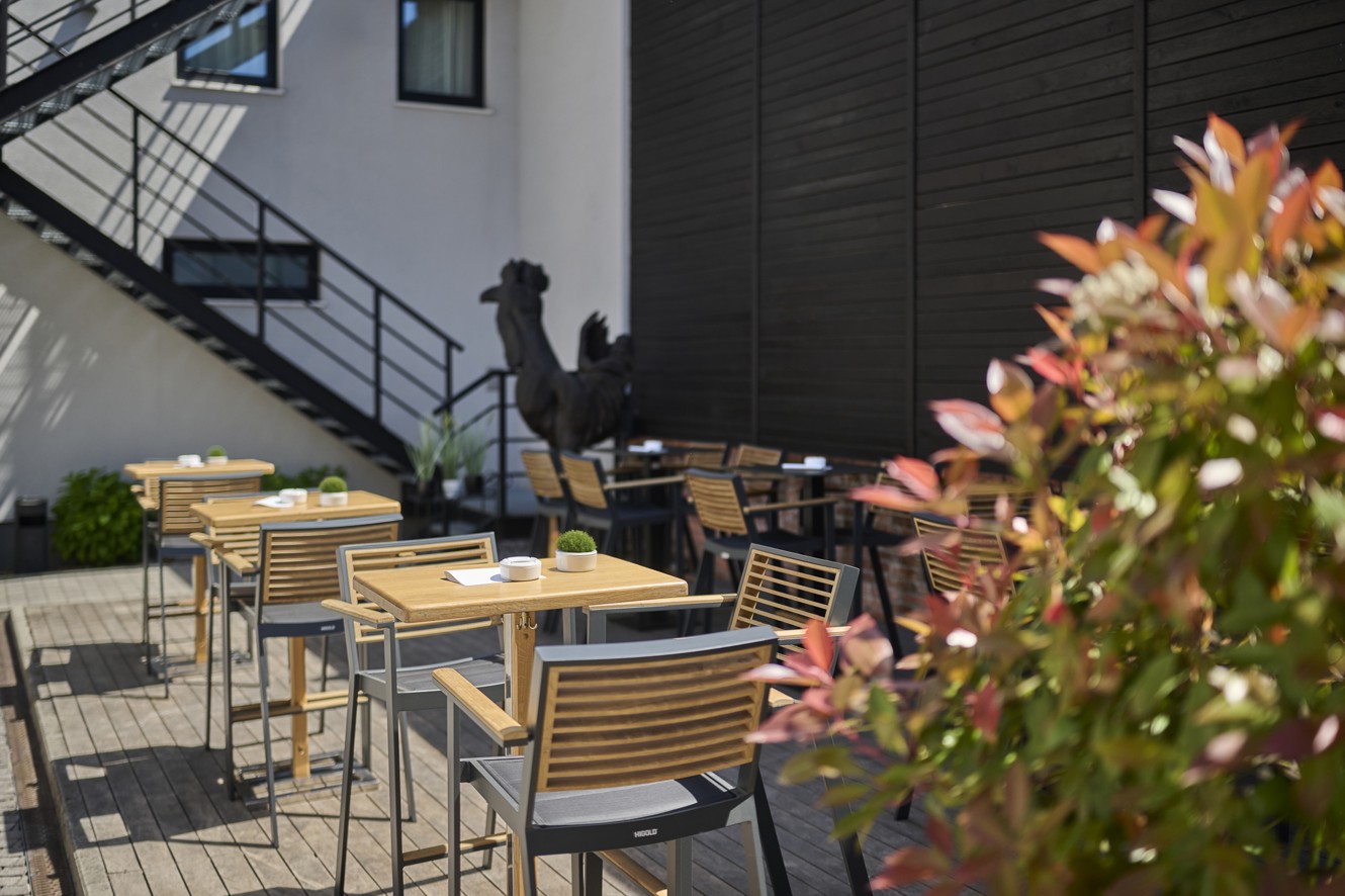 Lobby bar terrace of Aminess Florian Godler Hotel with outdoor seating.