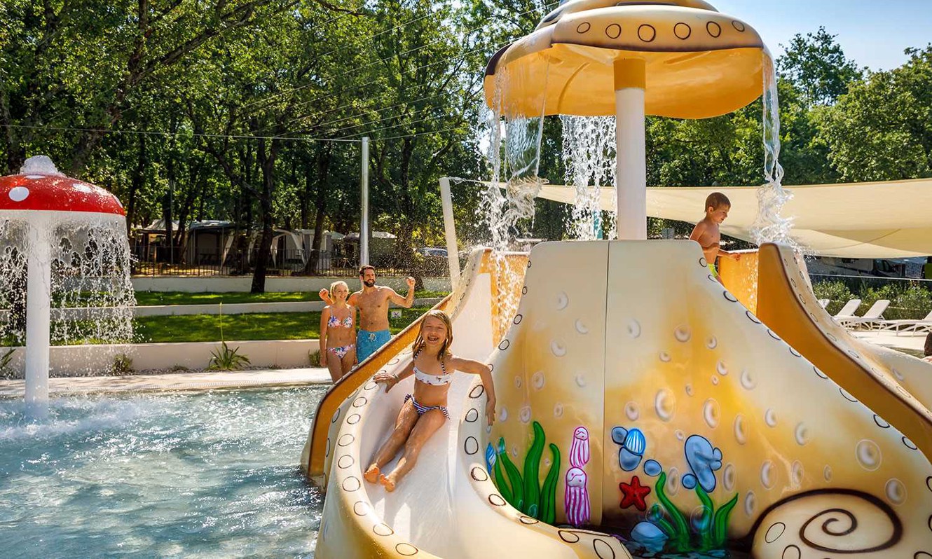 Family having fun at the pool at Aminess Planet Camping Maravea, Novigrad