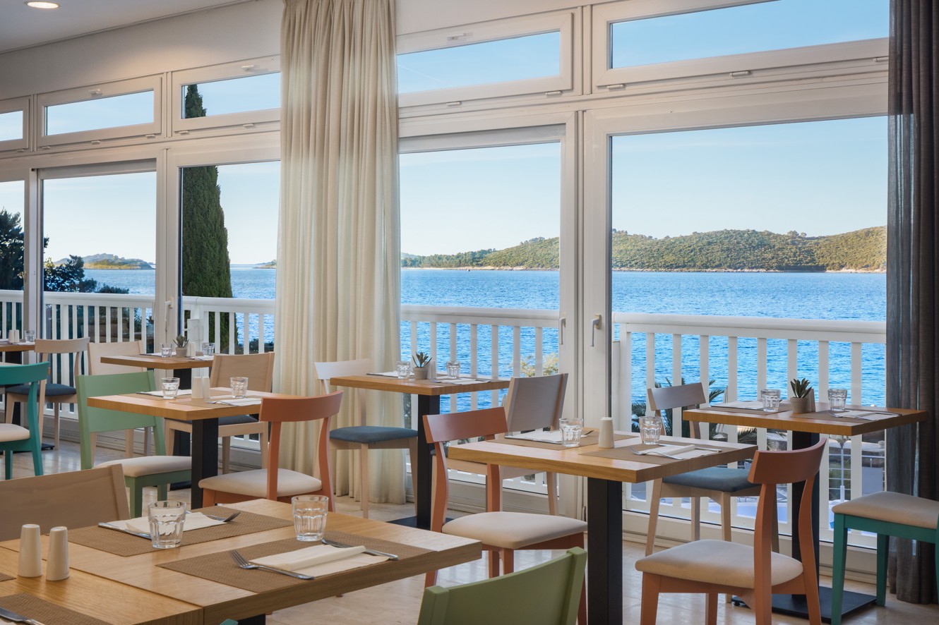 Restaurant at Orsan Maradiso Hotel by Aminess with a sea view.