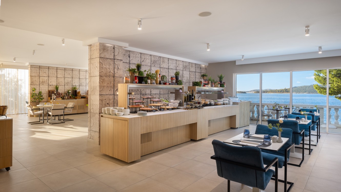 Buffet restaurant at Younique Bellevue Hotel by Aminess with a sea view.