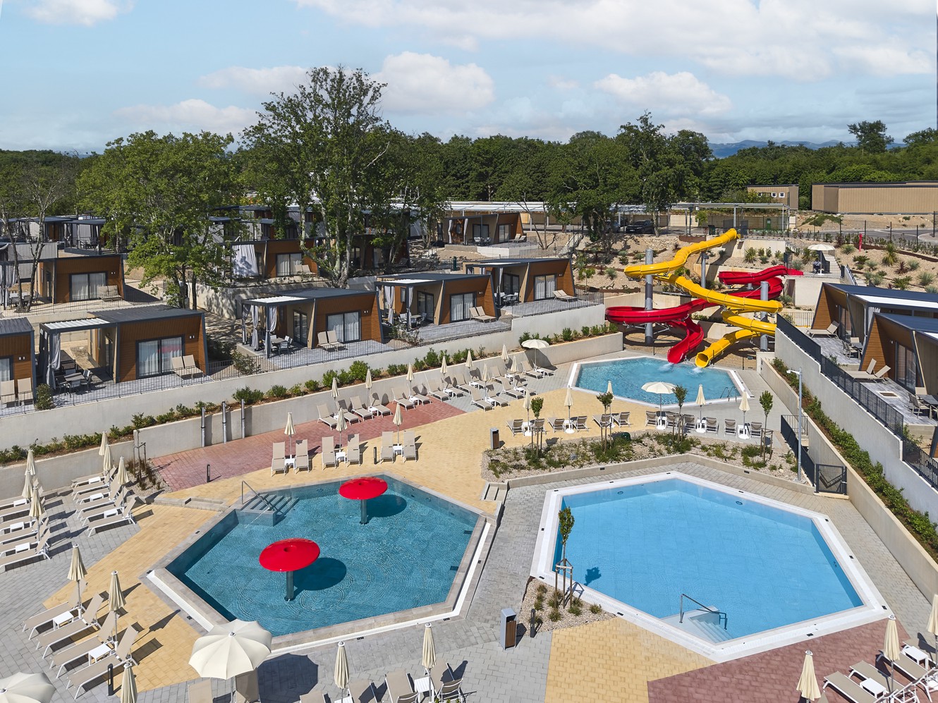 Pool complex with water slides and mobile homes at Aminess Atea Camping Resort.