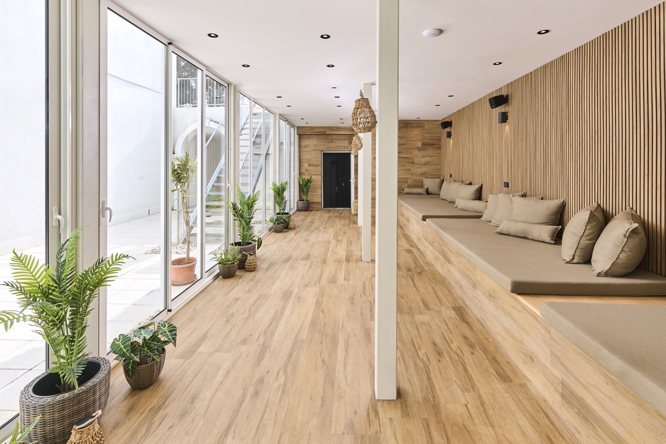 Relaxation lounge with loungers and natural light in the hotel wellness area