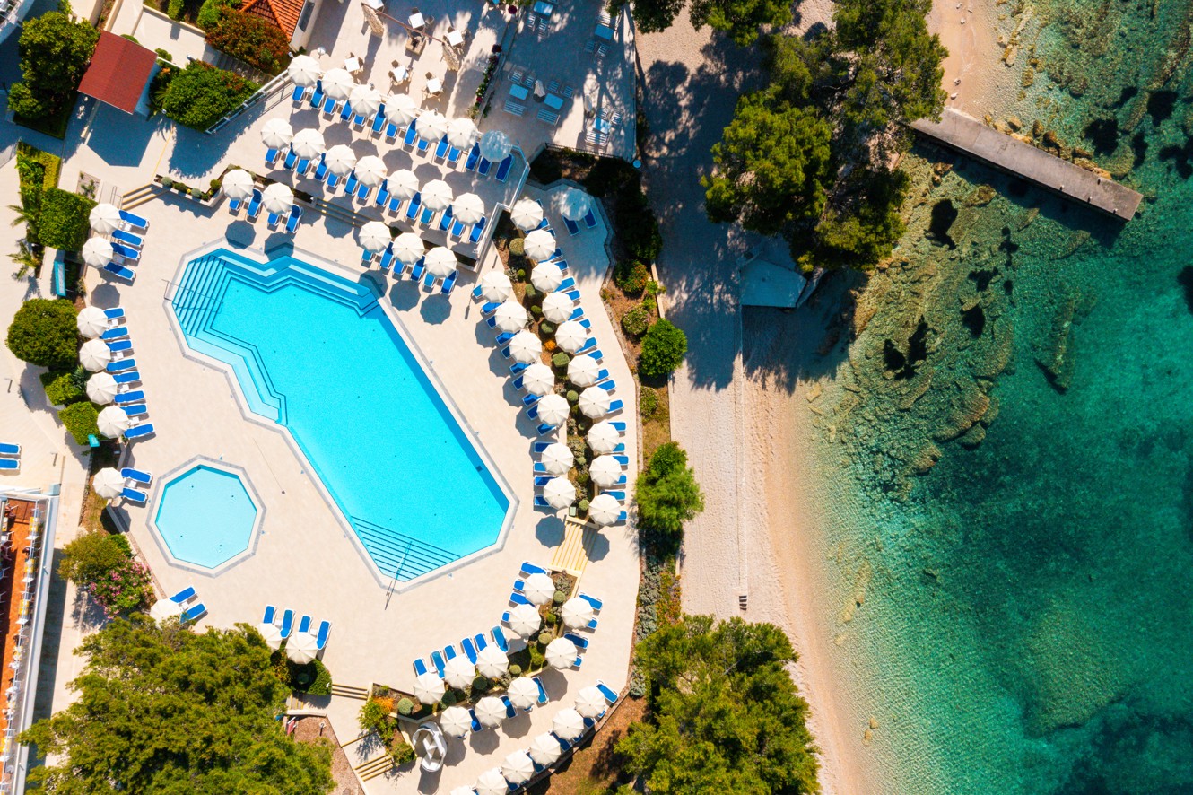 Aerial view of the pool with loungers in front of the Aminess Vival Grand Azur Hotel, Orebić.