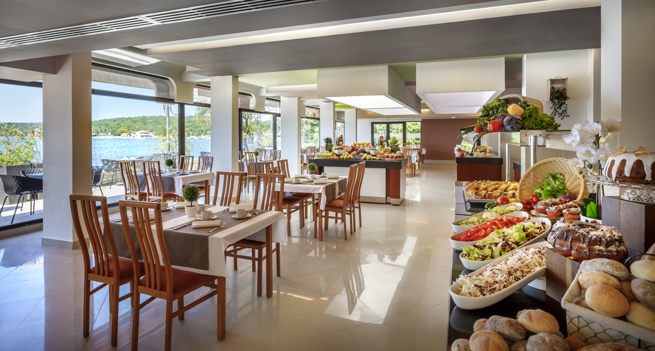 Dining area with a variety of fresh breakfast options at Veya Maradiso Hotel by Aminess.