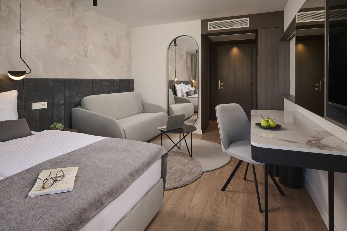 Superior room at Aminess Florian Godler Hotel with work desk.
