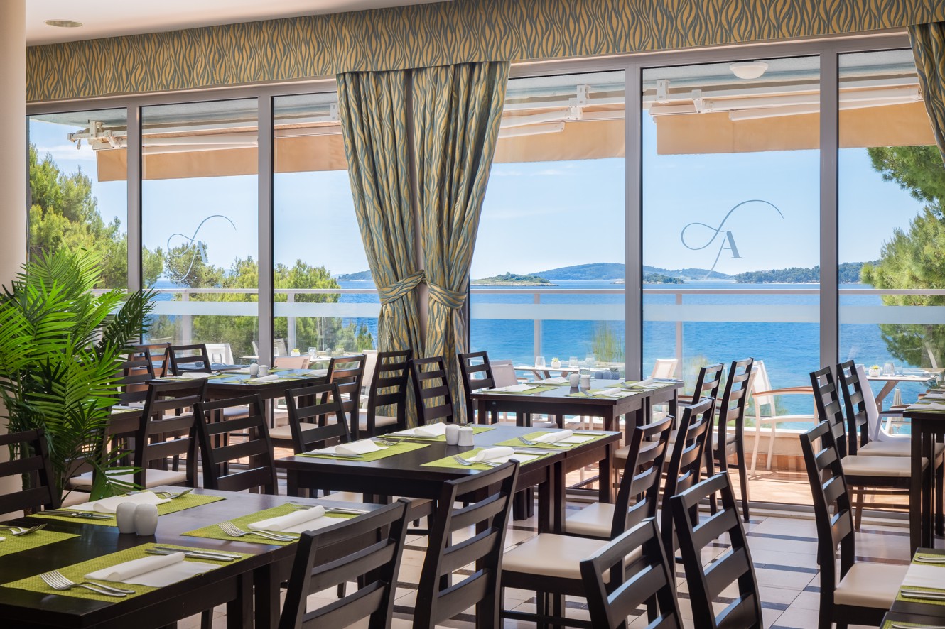Restaurant interior at Aminess Vival Grand Azur Hotel with a sea view.