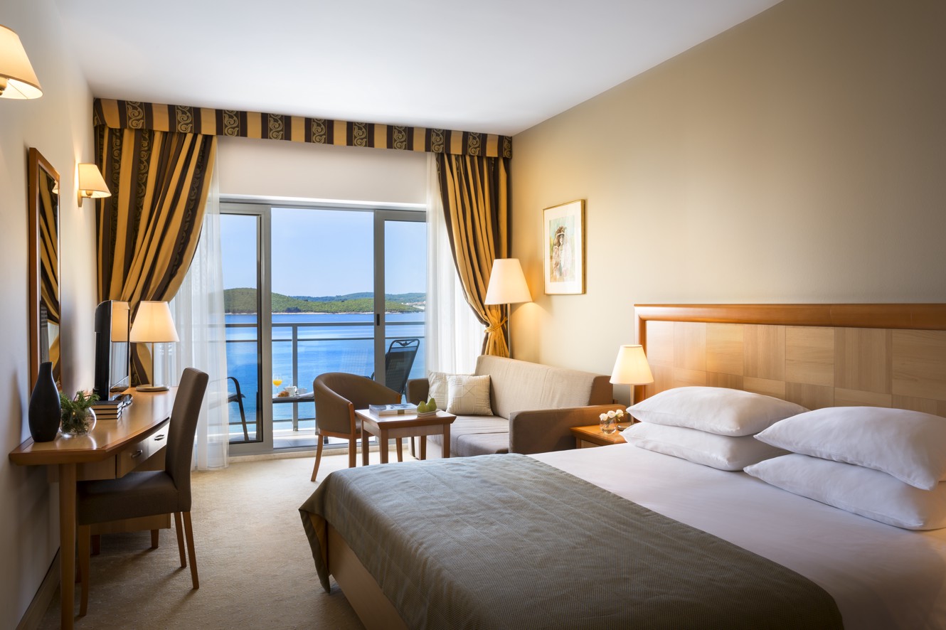Cosy and modern room with a sea view balcony at Aminess Grand Azur Hotel.