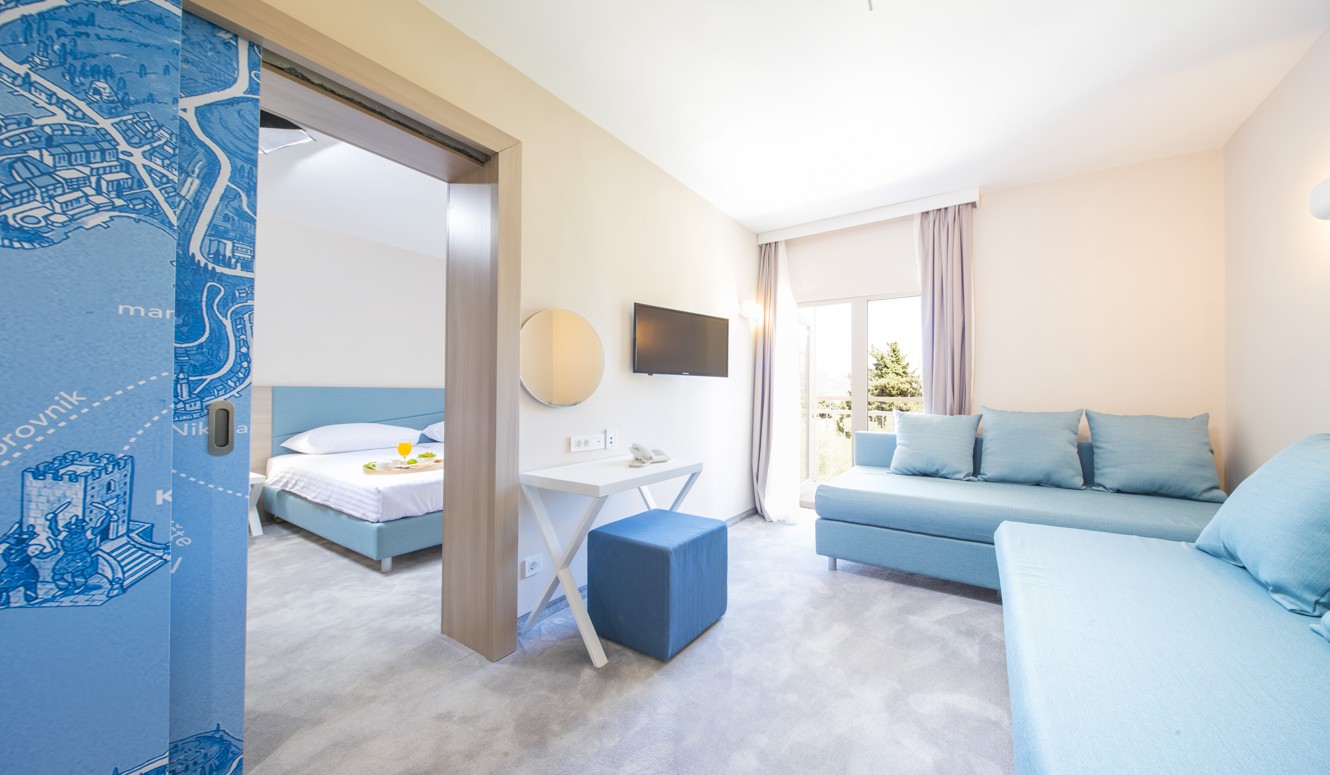 Modern room interior decor in a blue pallete at Aminess Vival Port9 Resort.