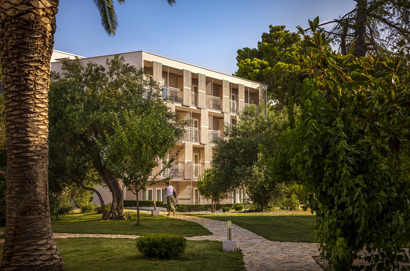 Orno building, room complex at Aminess Vival Port9 Resort surrounded by lush greenery.