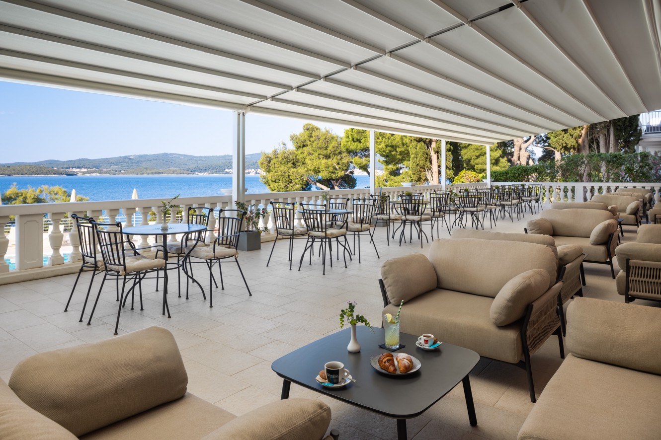 Bar Noir terrace at Younique Bellevue Hotel by Aminess with lounge seating and sea view.