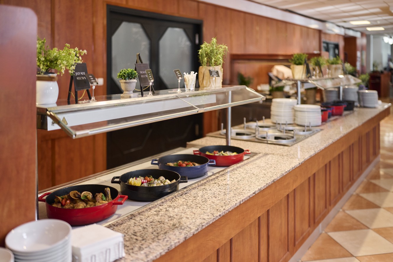 Hot buffet with dishes in Bellaria restaurant at Aminess Maradiso Hotel