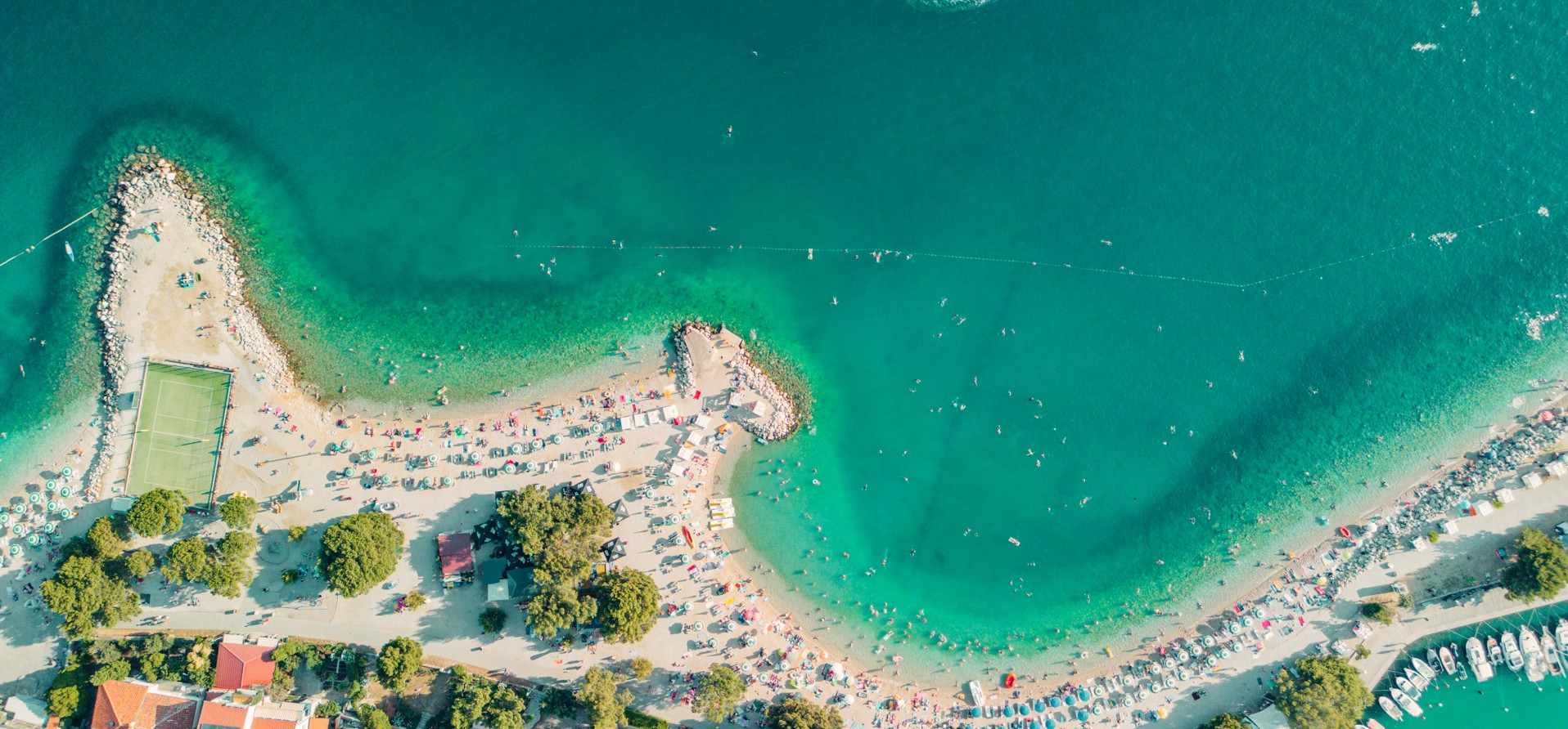 Aerial view of the coastline and beach with turquoise waters in Crikvenica, Croatia.