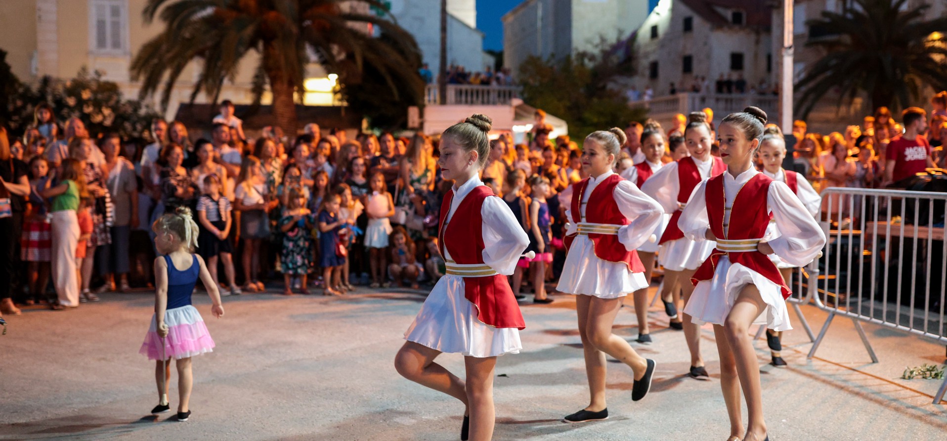 A local cultural dance performance on Brač Island, Croatia, showcasing traditional attire and movements, celebrating the island's rich heritage and customs.