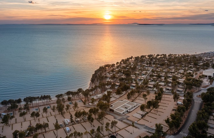 Panoramic views of the pitches for campers and the sunset at Aminess Style Camping Avalona resort.