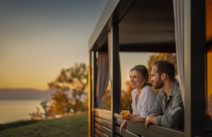 Couple enjoying the sea view from an Aminess Style Camping Atea Resort holiday home.