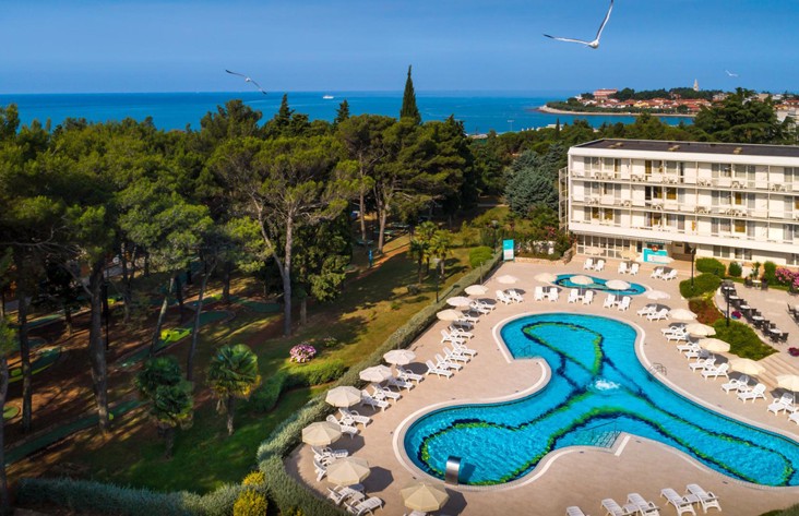 Aerial view of Aminess Maradiso Hotel Laguna, pool and sea.