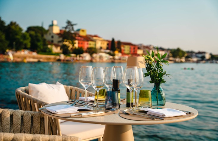 A beautifully set outdoor terrace with a sea view at 7 Seas Restaurant & Bar near Veya Maradiso Hotel by Aminess..