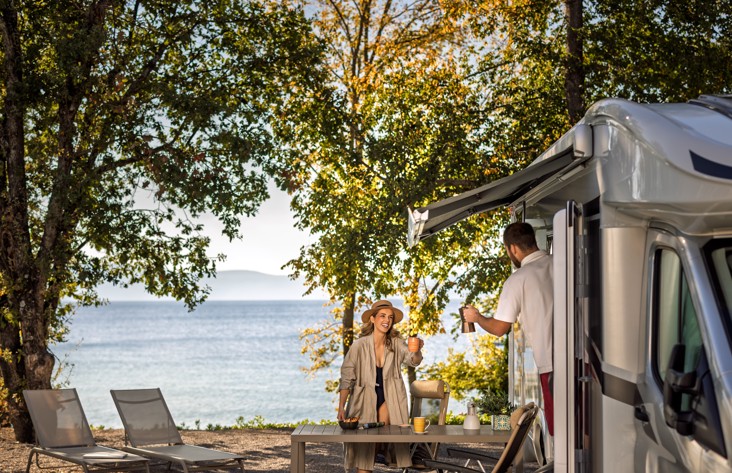 Lifestyle scene at a luxury camping pitch by the sea with a private pool at Aminess campsite