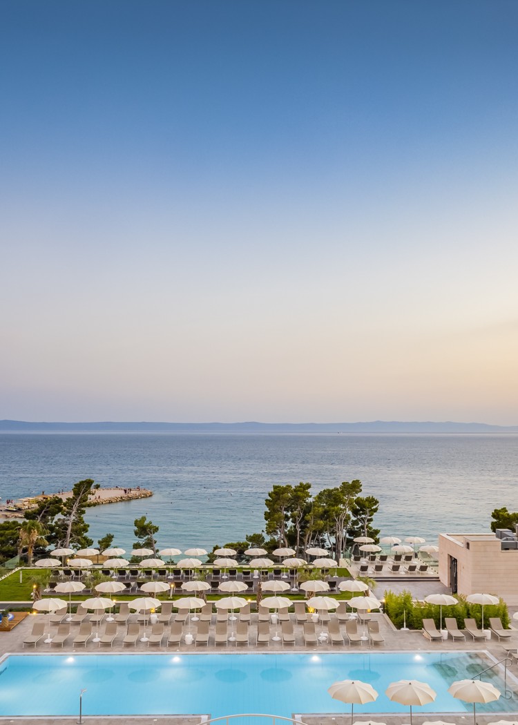 Aerial view of the swimming pool with a sunset at Aminess Laurel Hotel Khalani