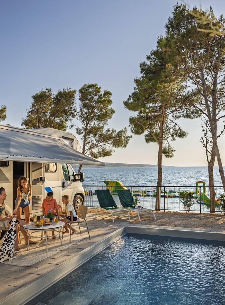 Family relaxing by a private pool at Aminess Style Camping Avalona Resort.