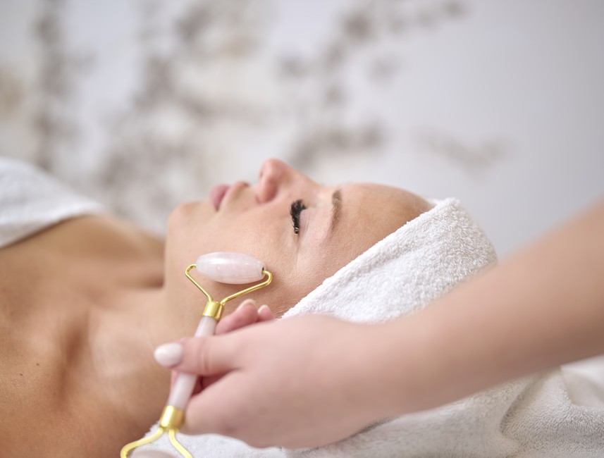 Relaxing spa treatment with a face roller at Aminess Style Camping Atea Resort, enhancing skin rejuvenation in a serene environment.