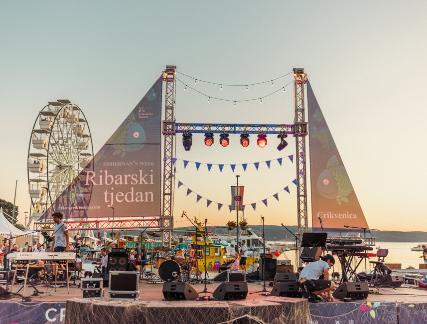 Fishermen's Week event in Crikvenica with a Ferris wheel and festive atmosphere by the sea.
