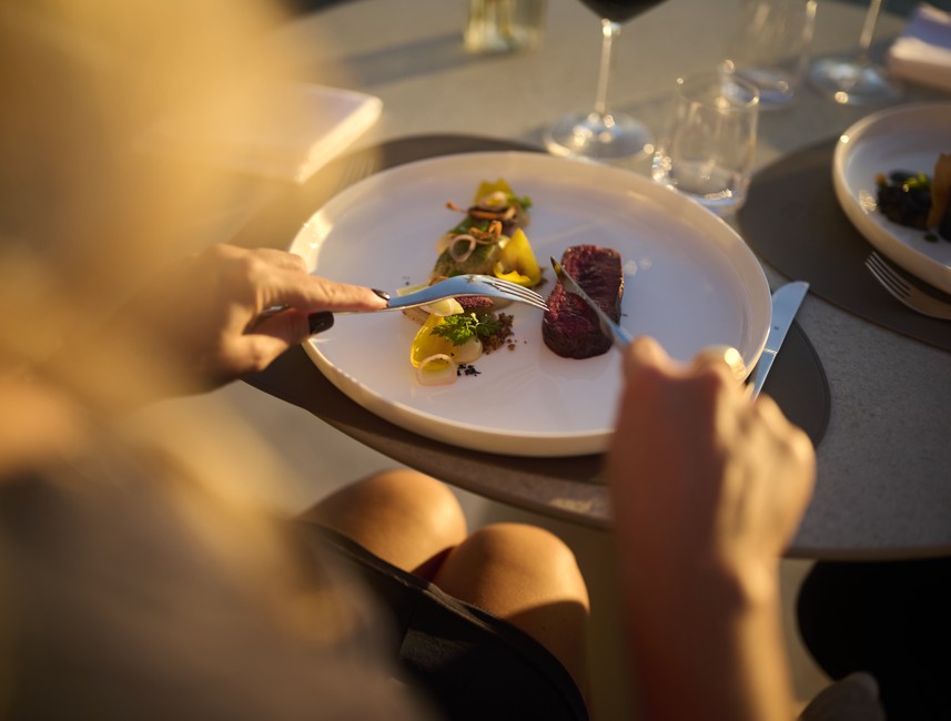 Guest enjoying a fine dining gourmet dish during the Aminess Wine & Gourmet Nights at the 7 Seas restaurant