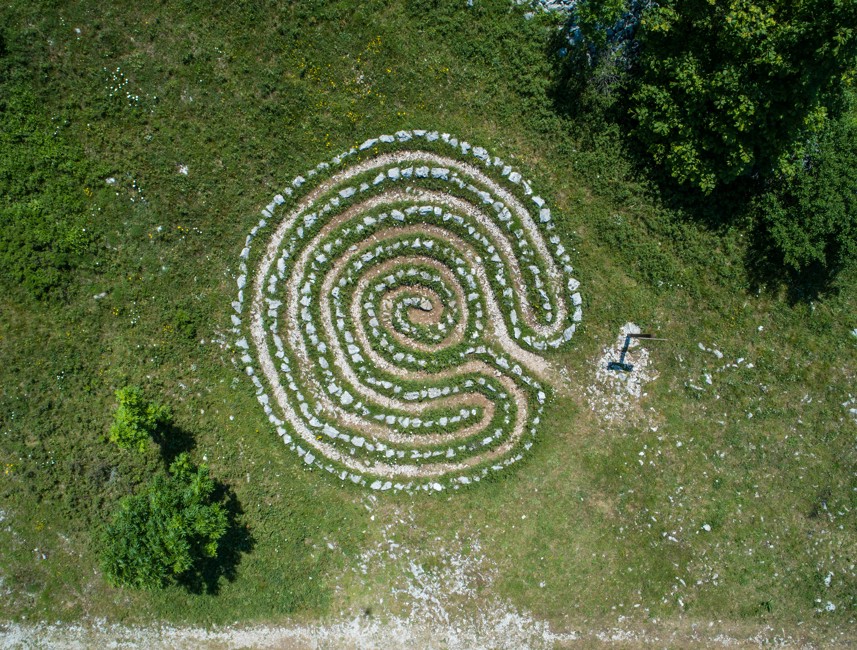 Aerial view of celestial labyrinths in Krmpote, Novi Vinodolski, Croatia, surrounded by greenery.
