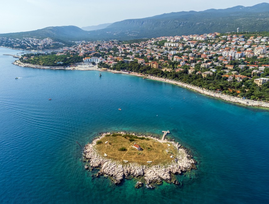 Aerial view of San Marino Island in Novi Vinodolski, Croatia, surrounded by the Adriatic Sea.
