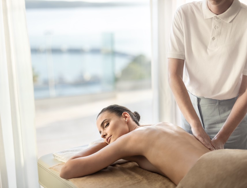 Relaxing back massage at Aminess Younique Narrivi Hotel spa in Crikvenica, offering wellness and tranquility.