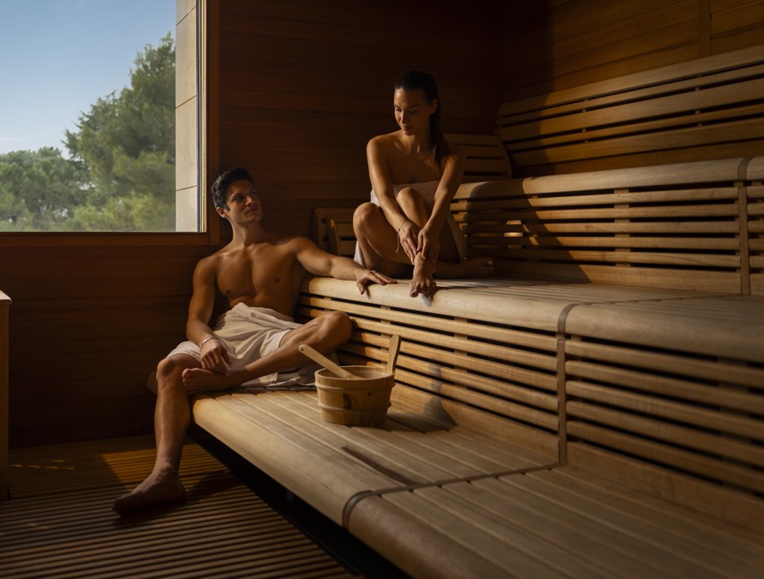 Couple relaxing in the sauna, enjoying the heat and tranquility.